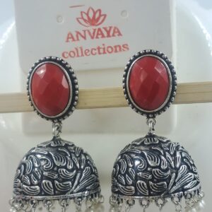 Elegant Oxidized Brass Jhumka Earrings with Red Stone Studs and Pearl Dangling Detailing